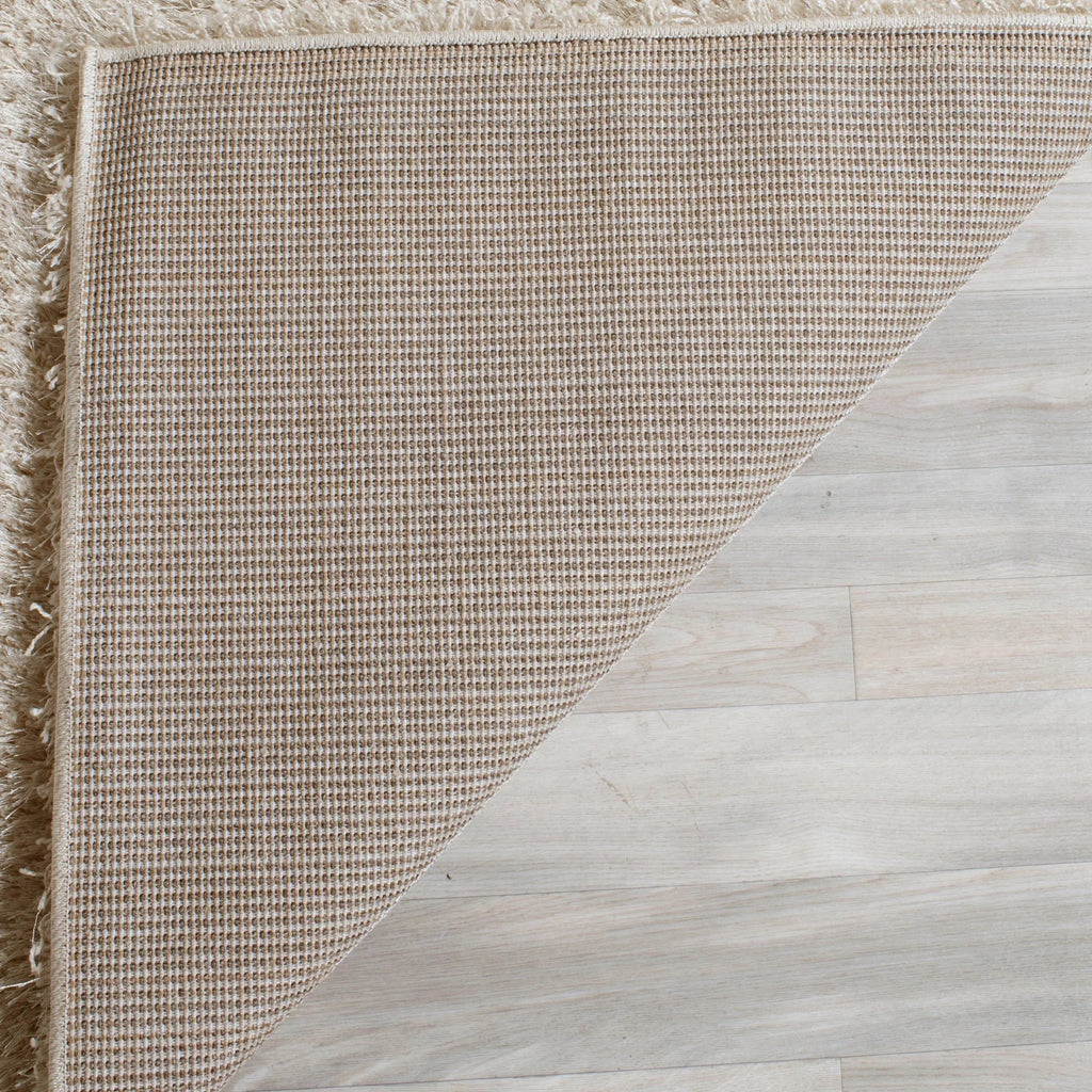SAFAVIEH Charlotte Solid Plush Shag Area Rug, Ivory, 8' x 10'